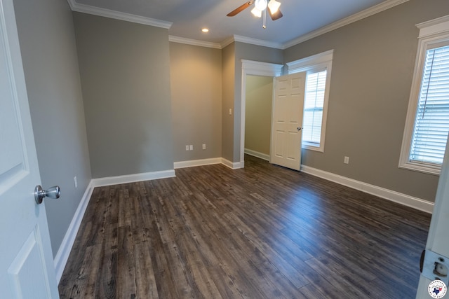 unfurnished bedroom featuring multiple windows and dark wood-type flooring
