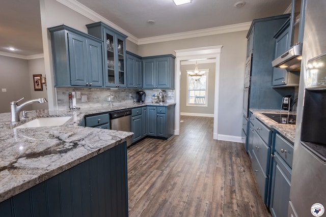 kitchen featuring a sink, dishwasher, black electric cooktop, blue cabinetry, and a chandelier