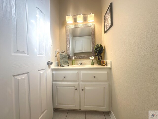 bathroom with vanity and tile patterned floors