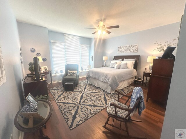 bedroom featuring hardwood / wood-style floors and ceiling fan