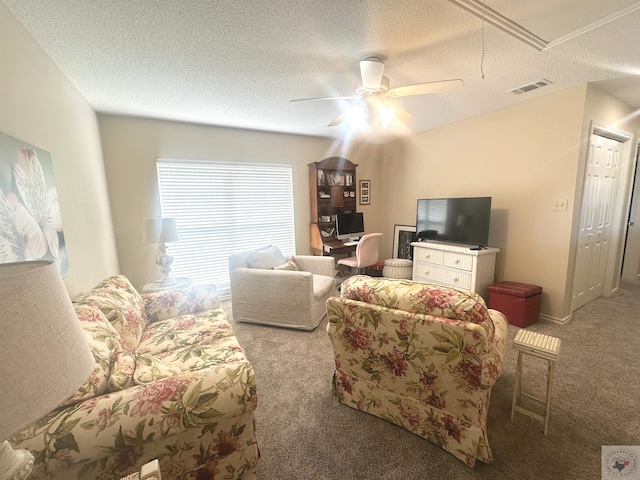 carpeted living room with a textured ceiling and ceiling fan