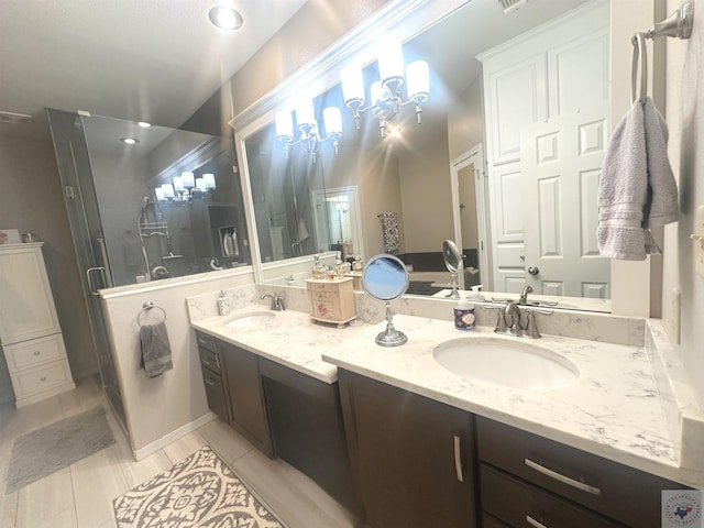 bathroom featuring vanity, tile patterned floors, and a shower with door