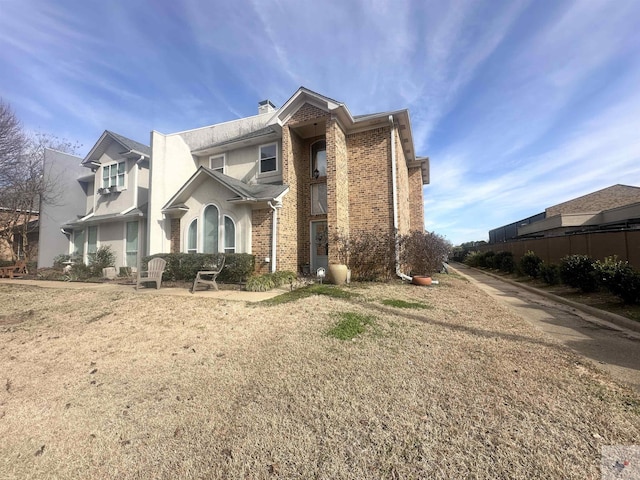 view of property exterior featuring a lawn