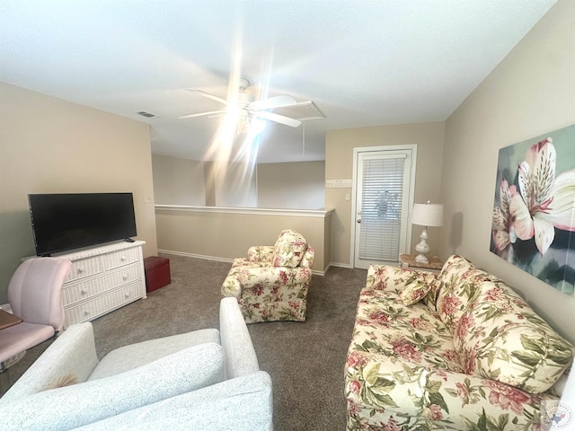 living room with ceiling fan and dark carpet