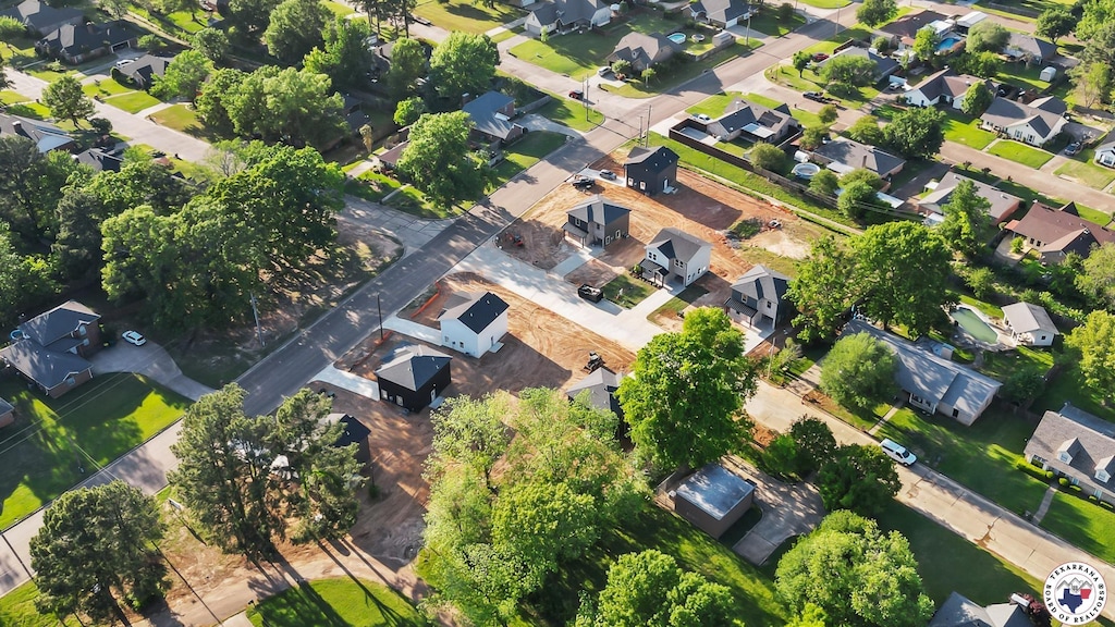 birds eye view of property with a residential view