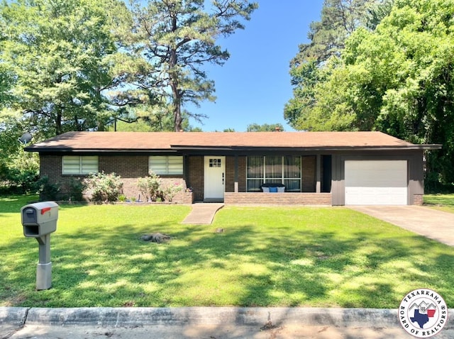 9 Camelia Ln, Texarkana, TX 75503 - single story home featuring brick siding, an attached garage, a front lawn, and driveway
