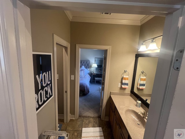 bathroom featuring ornamental molding, visible vents, and vanity