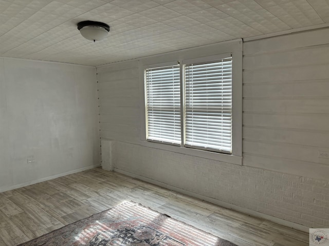 empty room with light hardwood / wood-style floors