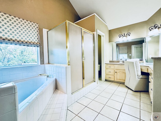 bathroom with vanity, lofted ceiling, separate shower and tub, and tile patterned flooring