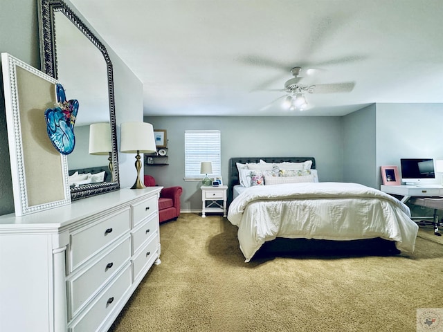 bedroom featuring ceiling fan and carpet