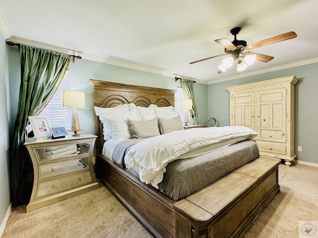 carpeted bedroom featuring ceiling fan and ornamental molding