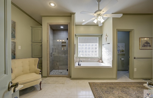 bathroom featuring ceiling fan, shower with separate bathtub, and tile patterned floors