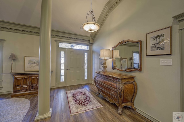 entryway featuring wood-type flooring, ornate columns, a high ceiling, and ornamental molding