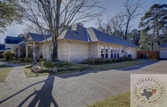 view of property exterior with a garage