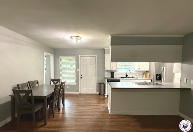 202 Mehaffey Dr, Dekalb, TX 75559 - kitchen featuring a sink, stainless steel fridge, baseboards, and dark wood finished floors