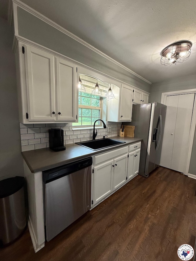 202 Mehaffey Dr, Dekalb, TX 75559 - kitchen featuring stainless steel appliances, a sink, white cabinetry, tasteful backsplash, and ornamental molding