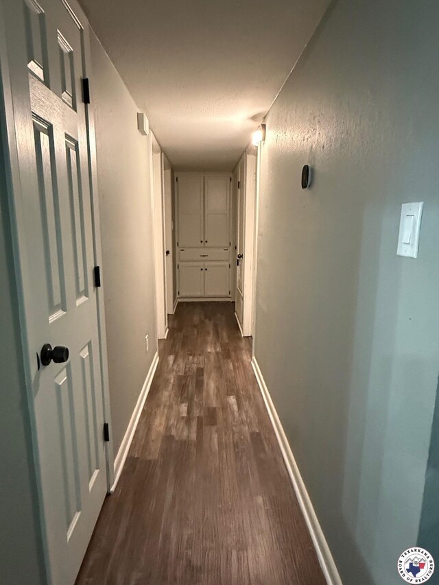 202 Mehaffey Dr, Dekalb, TX 75559 - hallway with dark wood-style floors and baseboards