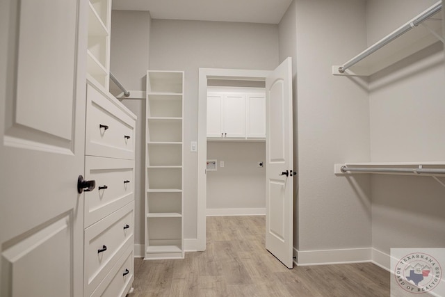 spacious closet featuring light wood-type flooring