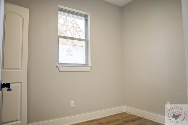 empty room with wood-type flooring