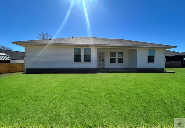 110 Village Pl, Wake Village, TX 75501 - rear view of house with a yard, fence, and roof with shingles