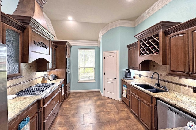 7 Coppercreek Cir, Texarkana, TX 75503 - kitchen featuring a sink, stainless steel appliances, light stone countertops, backsplash, and crown molding