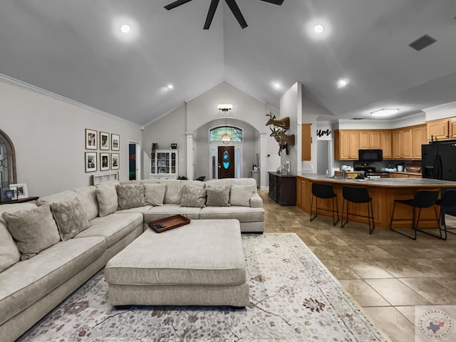 living room featuring decorative columns, ceiling fan, ornamental molding, and lofted ceiling