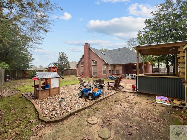 view of yard with a patio and a playground