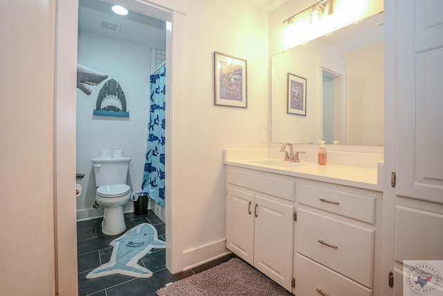 bathroom featuring tile patterned floors, visible vents, toilet, vanity, and baseboards