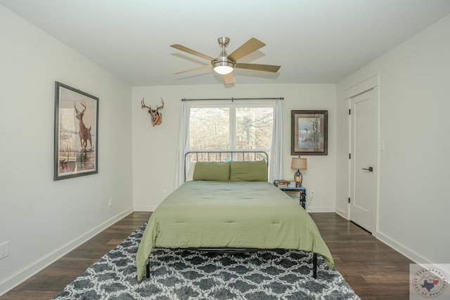 bedroom with ceiling fan, baseboards, and dark wood-style flooring