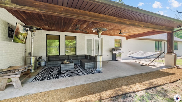 view of patio / terrace with outdoor lounge area, a ceiling fan, and area for grilling
