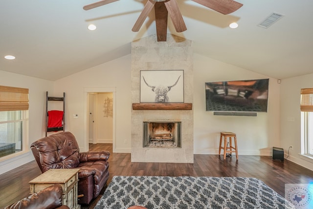 living area with ceiling fan, visible vents, wood finished floors, and lofted ceiling with beams