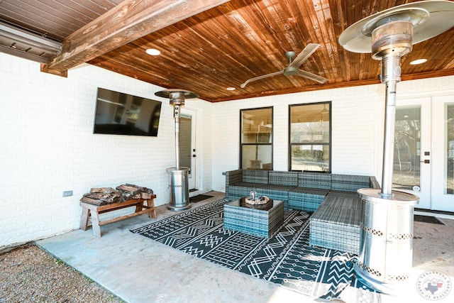 view of patio / terrace featuring ceiling fan, an outdoor hangout area, and french doors