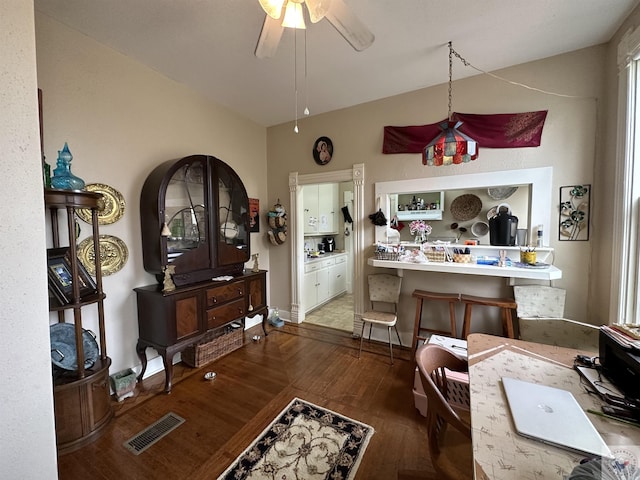 interior space featuring hardwood / wood-style floors and ceiling fan