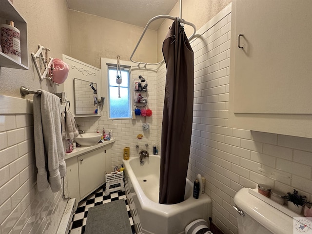 full bathroom with shower / bath combo with shower curtain, toilet, and vanity