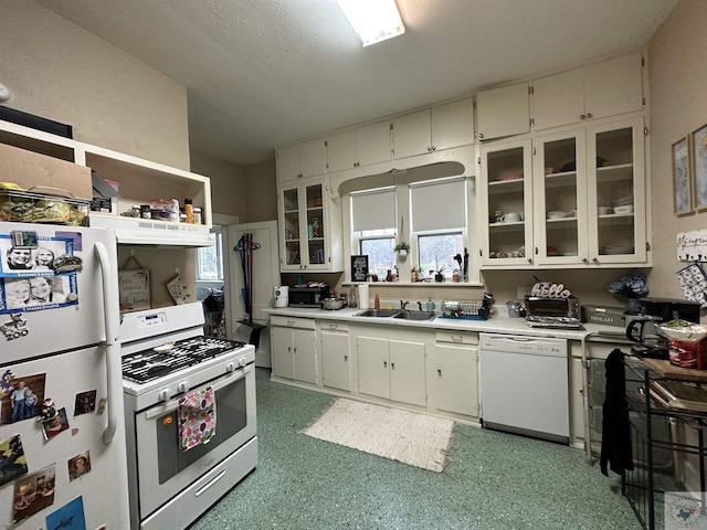 kitchen featuring sink and white appliances