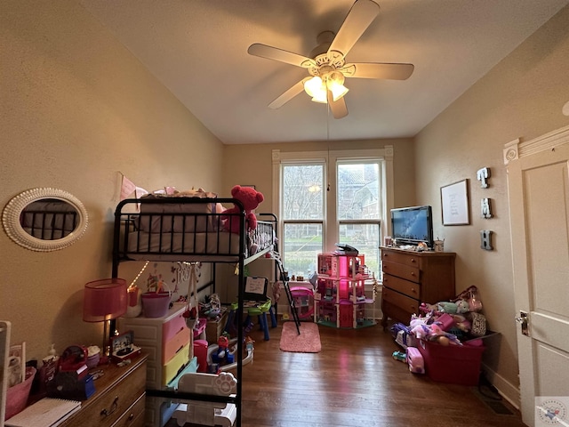 bedroom with dark hardwood / wood-style floors and ceiling fan