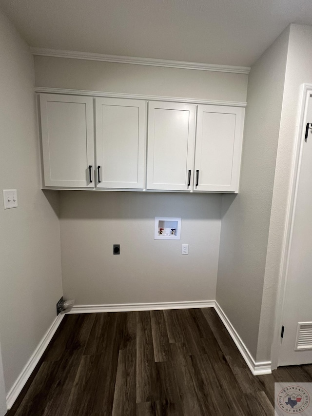 laundry room with hookup for a washing machine, baseboards, cabinet space, electric dryer hookup, and dark wood-type flooring