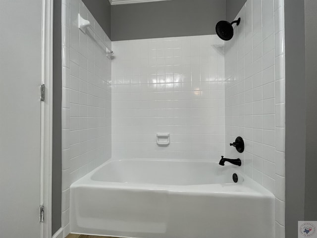 bathroom with washtub / shower combination