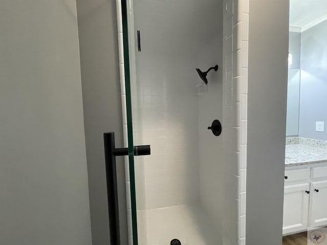 bathroom with wood-type flooring and a shower with door