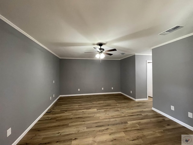 unfurnished room with hardwood / wood-style flooring, crown molding, and ceiling fan