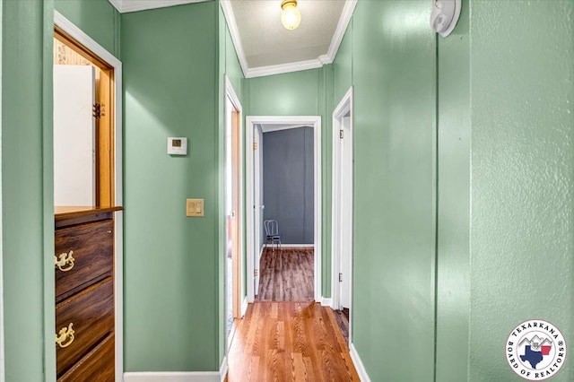 2520 County Road 326, W, TX 75706 - hall featuring ornamental molding, wood finished floors, and baseboards