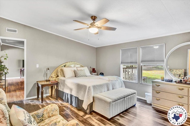 2520 County Road 326, W, TX 75706 - bedroom with wood finished floors, ornamental molding, baseboards, and a ceiling fan