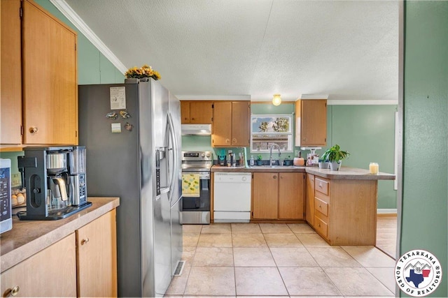 2520 County Road 326, W, TX 75706 - kitchen with appliances with stainless steel finishes, under cabinet range hood, ornamental molding, a sink, and a textured ceiling