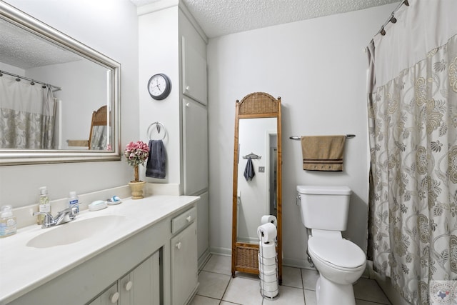 bathroom with toilet, a textured ceiling, tile patterned flooring, vanity, and a shower with curtain