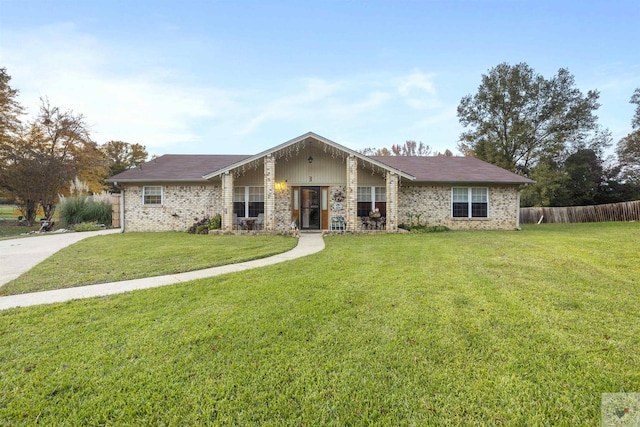 ranch-style house featuring a front lawn