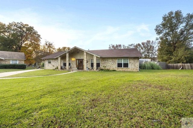 single story home featuring a front yard