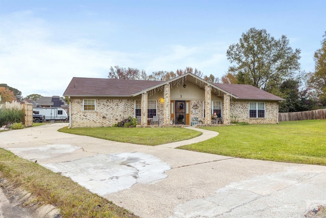 ranch-style house with a front lawn