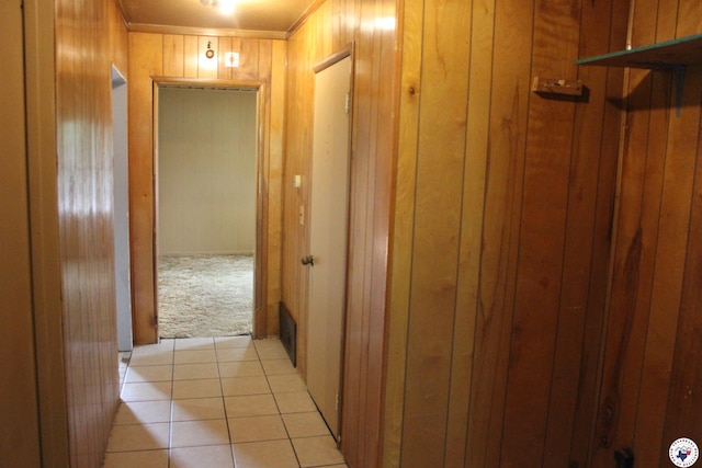 403NFOSTER N Foster St, Linden, TX 75563 - hallway featuring wood walls, light tile patterned flooring, light carpet, and ornamental molding