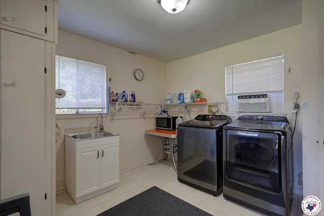 1302 Canadian St, Texarkana, TX 75503 - laundry room with washer and dryer, cabinet space, and cooling unit