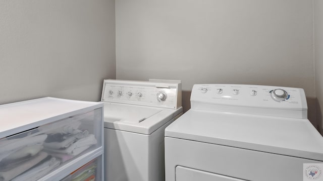7207 N Richland Dr, Texarkana, TX 75503 - clothes washing area with washing machine and clothes dryer and laundry area